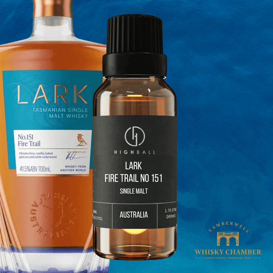 Bottle of Lark Tasmanian Single Malt Whisky and a smaller bottle labeled 'Lark Fire Trail No 151' on a blue background.